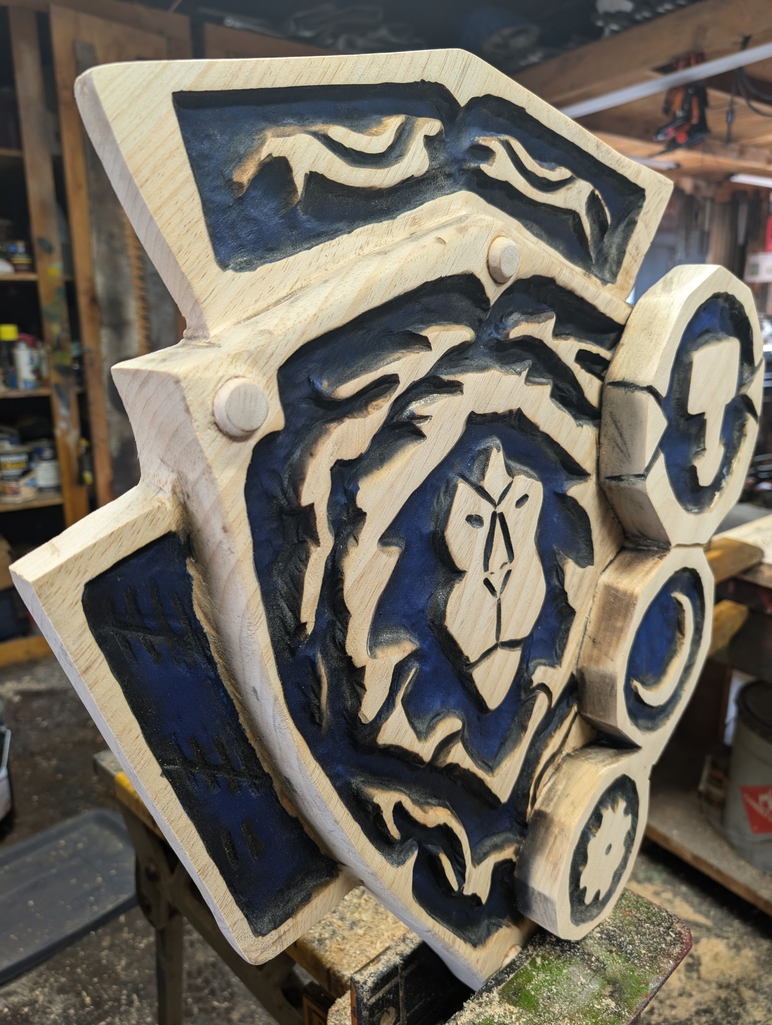 Epic Warcraft Alliance Ageis — chainsaw carving by The Grateful Tech