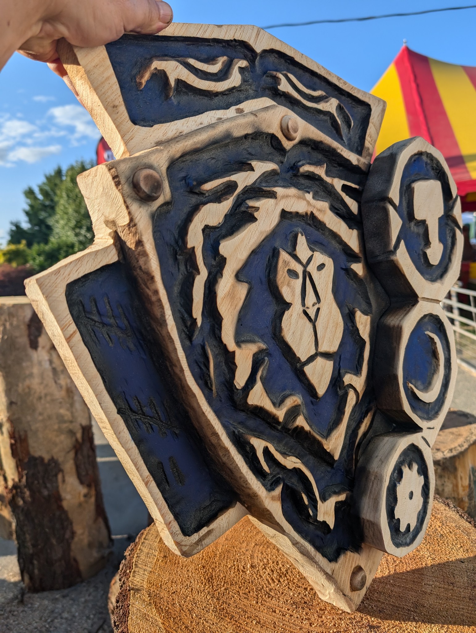 lion shield relief carving — chainsaw carving by The Grateful Tech