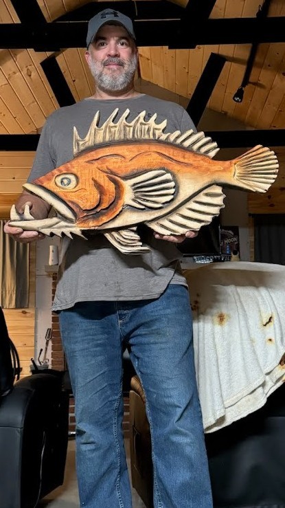 carved fish wall plaque — chainsaw carving by The Grateful Tech