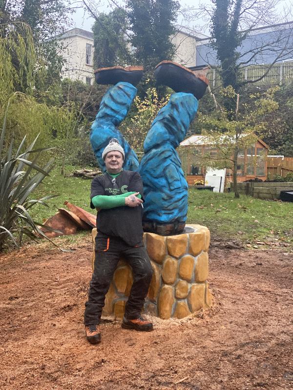Upside-down carved legs sycamore stump renovation — chainsaw carving by Woodaknot chainsaw carving & sculpting